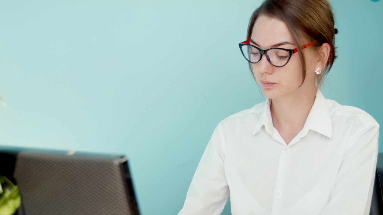 Young professional woman working on a laptop