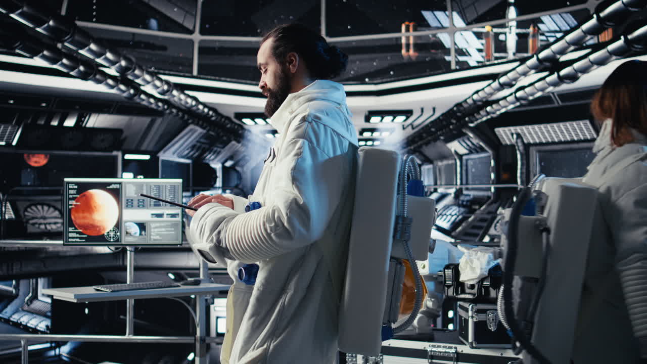 Astronaut monitoring life support systems before stepping out of space station