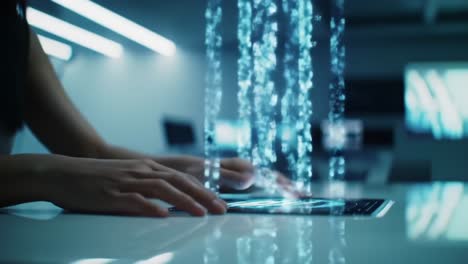 a futuristic interface: engaging with holographic data streams from a tablet in a high-tech workspace