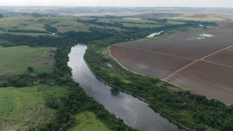 aerial footage following a river outside of the city of sao paulo, brazil