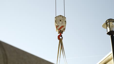 crane moving a large vehicle