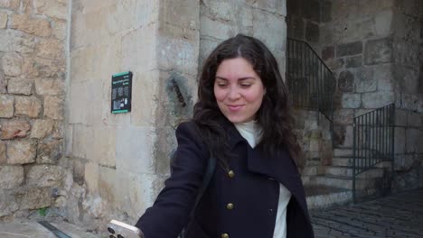woman taking selfie in old city