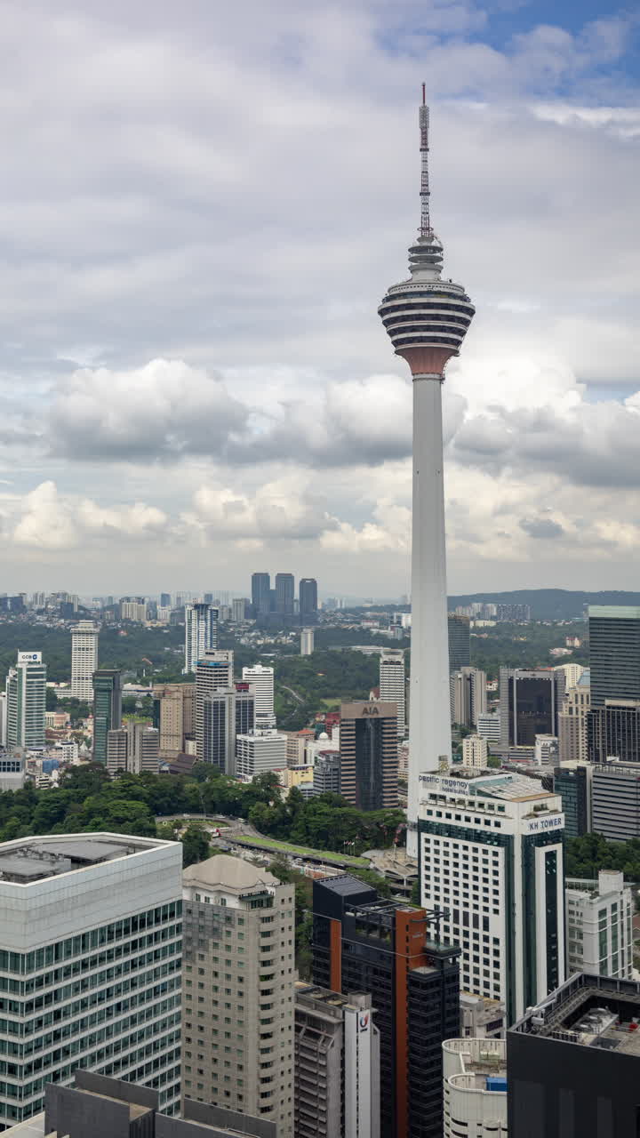 KUALA LUMPUR, MALAYSIA - 24 APRIL 2025 : Timelapse of the KL menara tower in kuala lumpur in vertical
