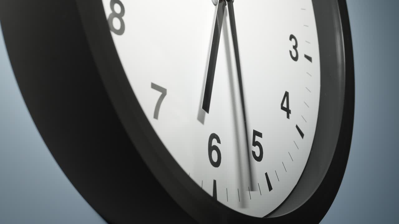 Clock Face on Light Blue Wall in Time Lapse