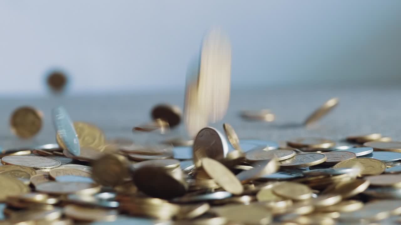 Slow Motion Video of Falling Golden Coins