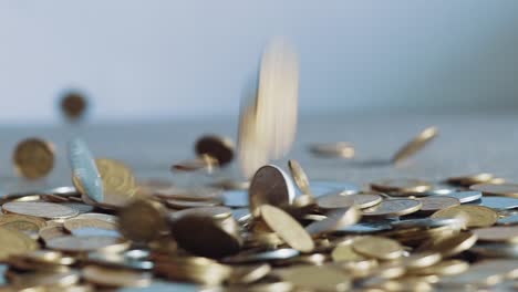 slow motion video of falling golden coins