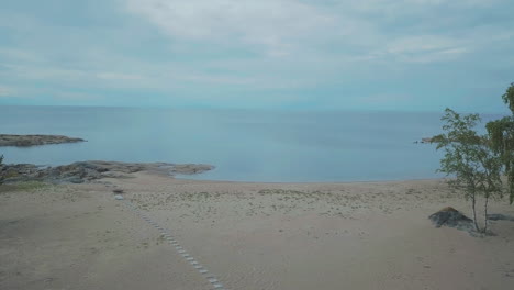 Aerial-Of-Natural-beach,Endless-Ocean-horizon-and-creamy-overcast-sky