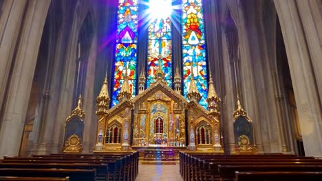 sunlight streaming through stained glass windows illuminates the altar and pews, creating a vibrant and sacred atmosphere