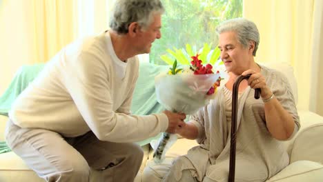 Man-bringing-a-bunch-of-flowers-to-his-wife-in-hospital