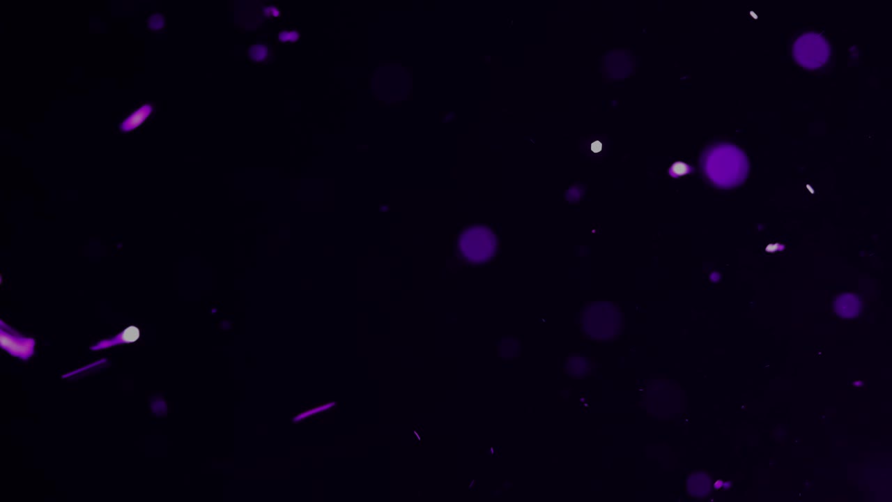 una ráfaga de destellos púrpuras y bolas de bokeh para la superposición de películas y efectos especiales