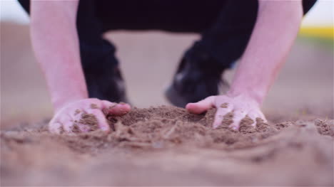 farmer examining organic soil in hands farmer touching dirt in agriculture field 2