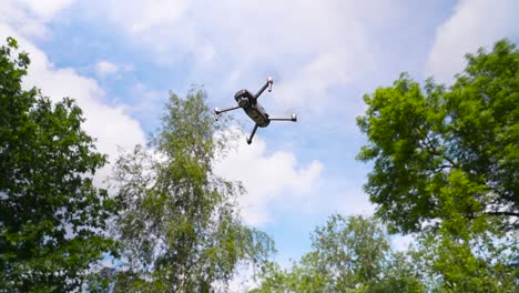 drone flying in a lush green forest