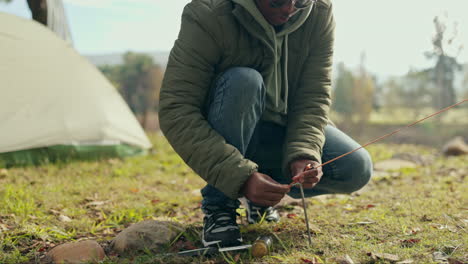 Camping,-hammer-and-black-man-in-nature-with-tent