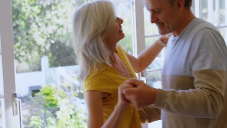 senior couple dancing on the porch at home 4k
