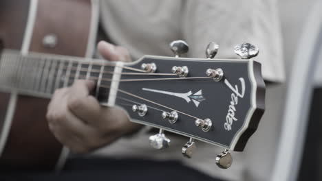 man playing guitar closeup