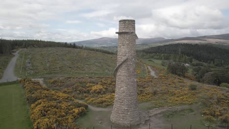 scenic view of the ballycorus leadmines tower in carrickgollogan park near dublin city, ireland - aerial pullback