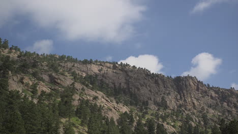 time lapse of clouds casting shadows on cliffs