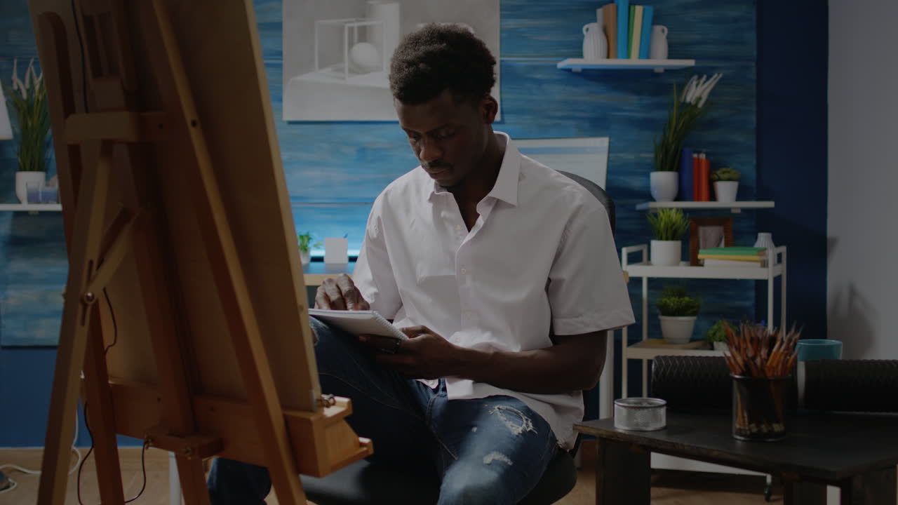 Man of african american ethnicity designing sketch