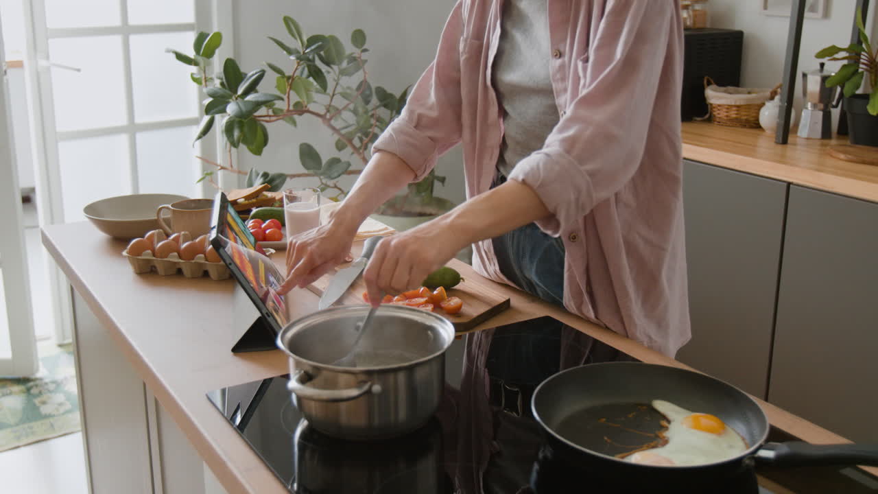 Woman preparing breakfast in the kitchen