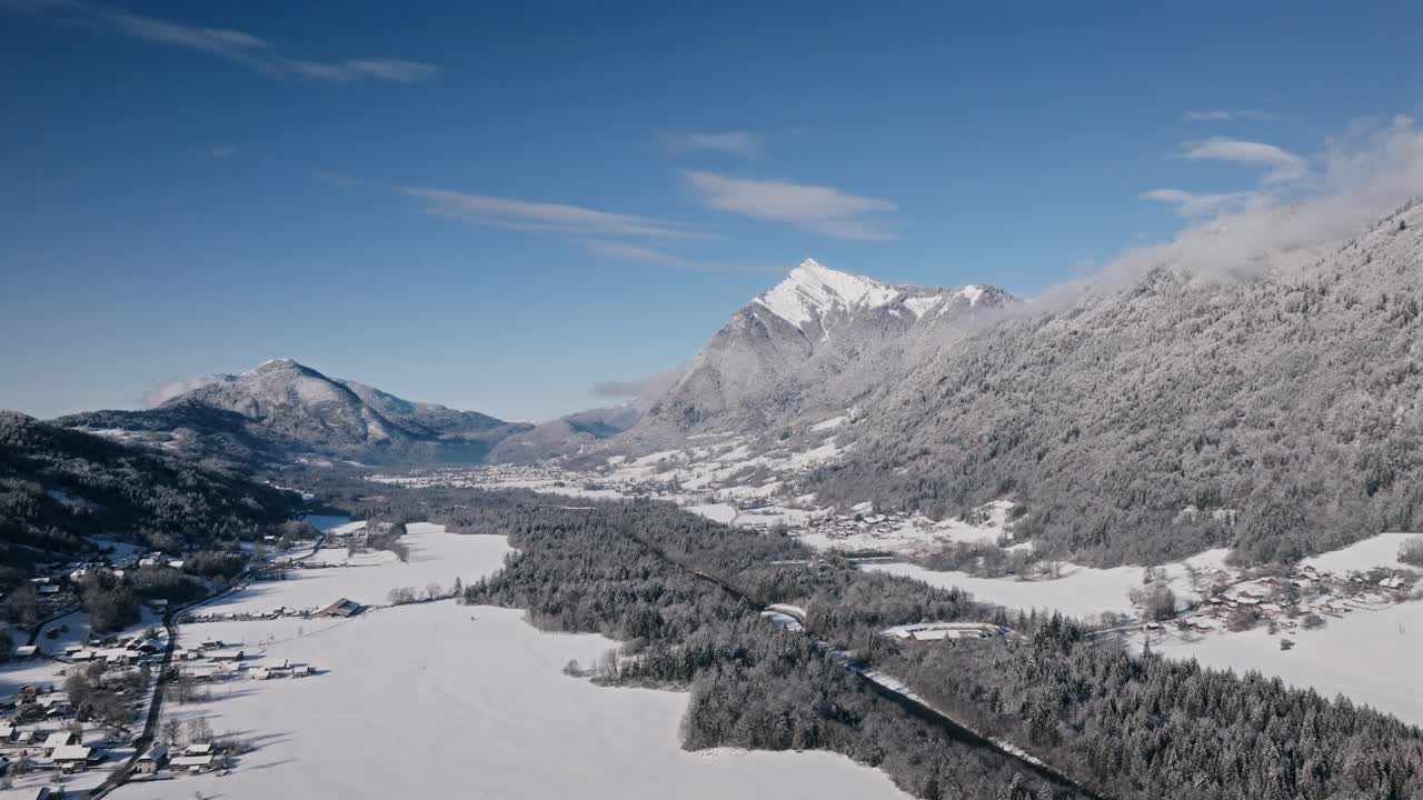 Snow-covered giffre valley with majestic mountains in winter, aerial view
