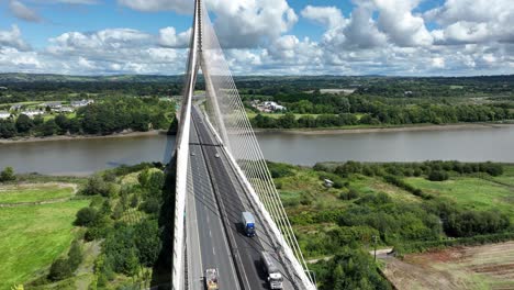 Drone-view-of-traffic-on-a-suspension-bridge-in-Waterford-Ireland-in-summer