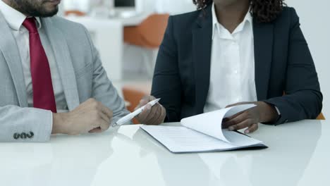 businessman and businesswoman signing contract