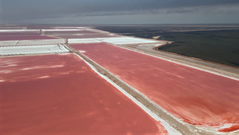 aerial view of salt flats with pink evaporation ponds