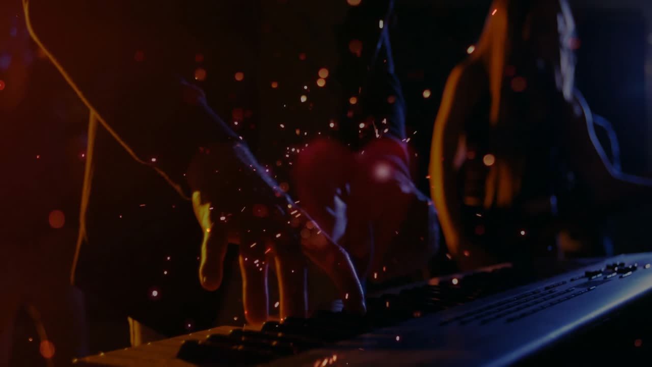 Keyboardist emitting sparks from pressing synthesizer keys, pulling camera into moody stage