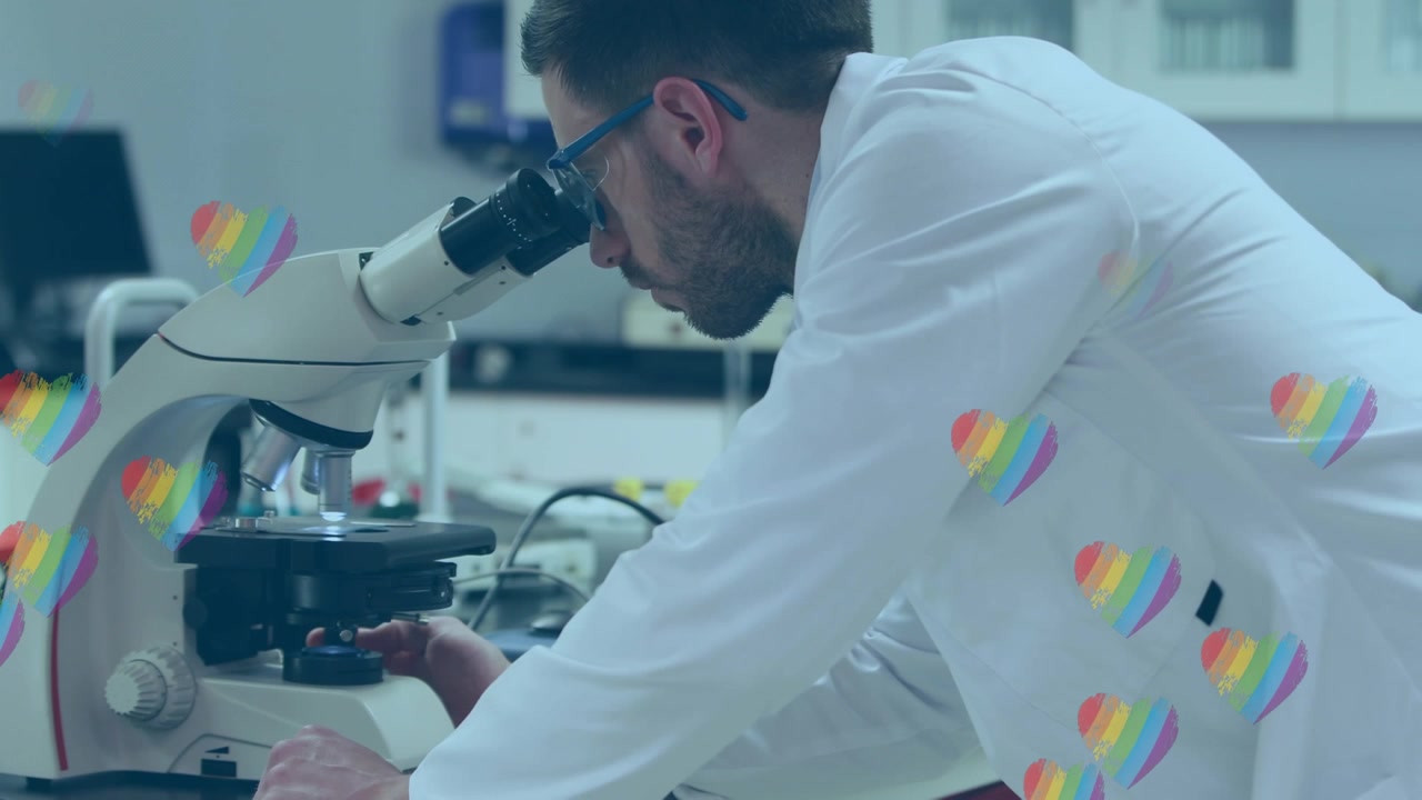 Male Scientist Using Microscope in Laboratory