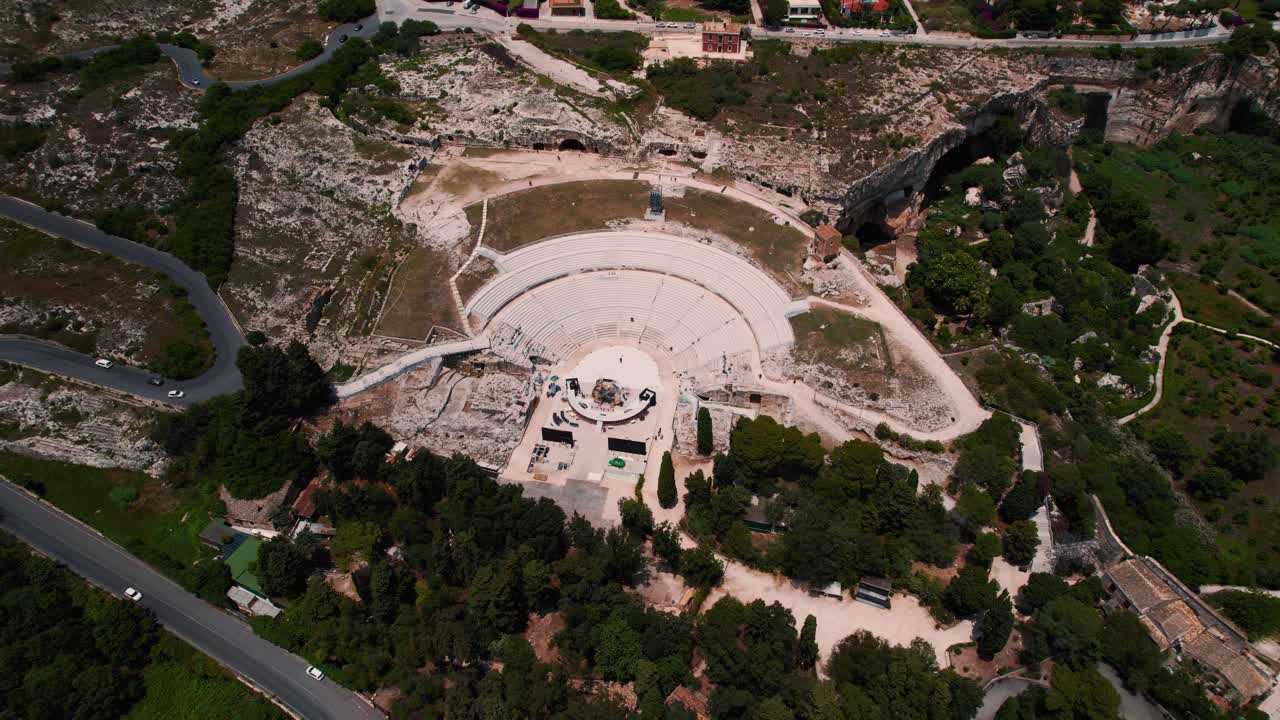 Amphitheater in Siracusa, Sicily, seen from above. Historic Roman archaeological cultural ruins.
