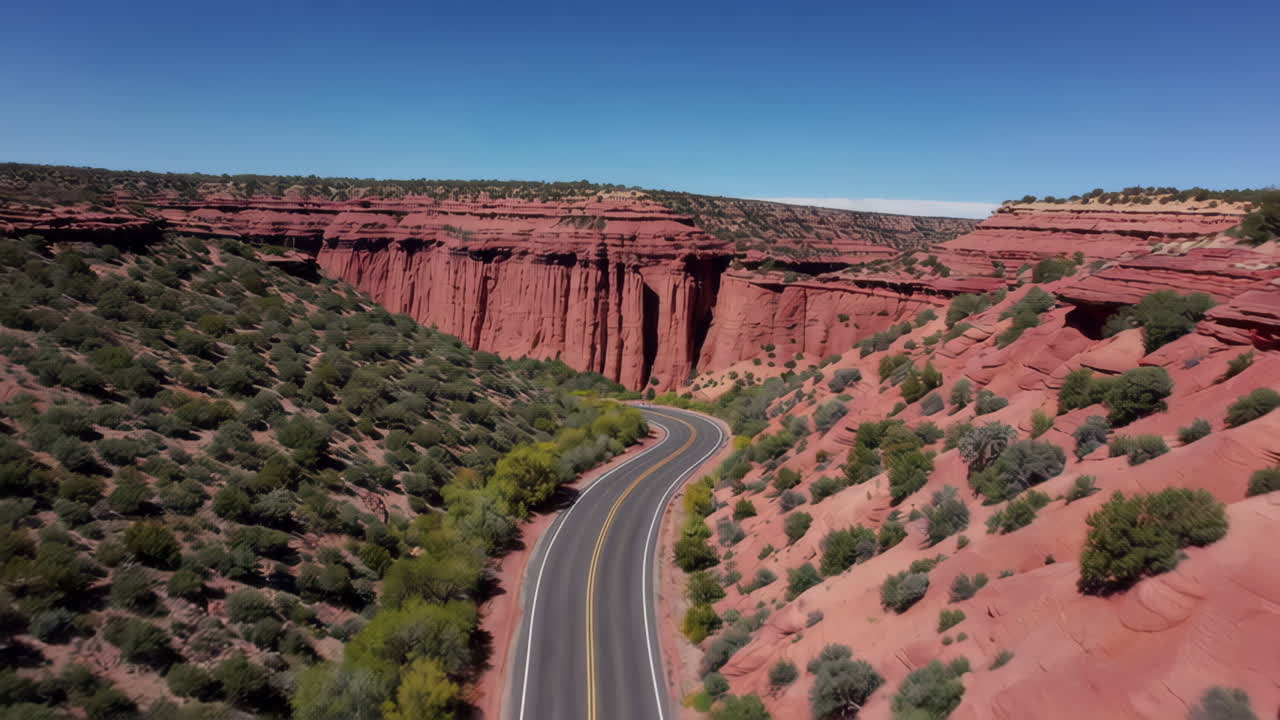 Scenic Winding Road Through a Red Rock Canyon