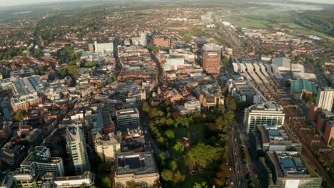 dolly back aerial shot over central reading uk at sunrise