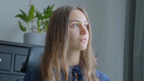 Young-Caucasian-woman-daydreaming-in-the-office,-in-Slow-Motion