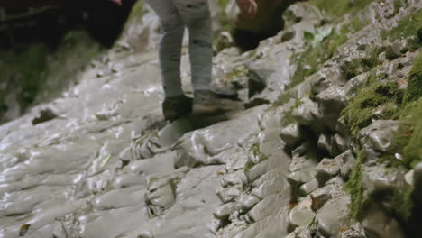 children hiking in a cave