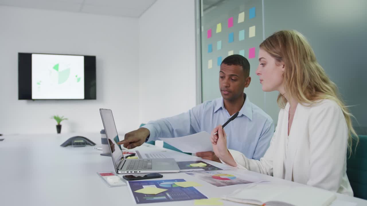 Man and woman discussing at the office