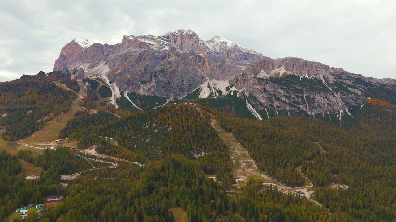 Fly over Cortina’s lush valleys and rugged mountains—a true alpine paradise.
