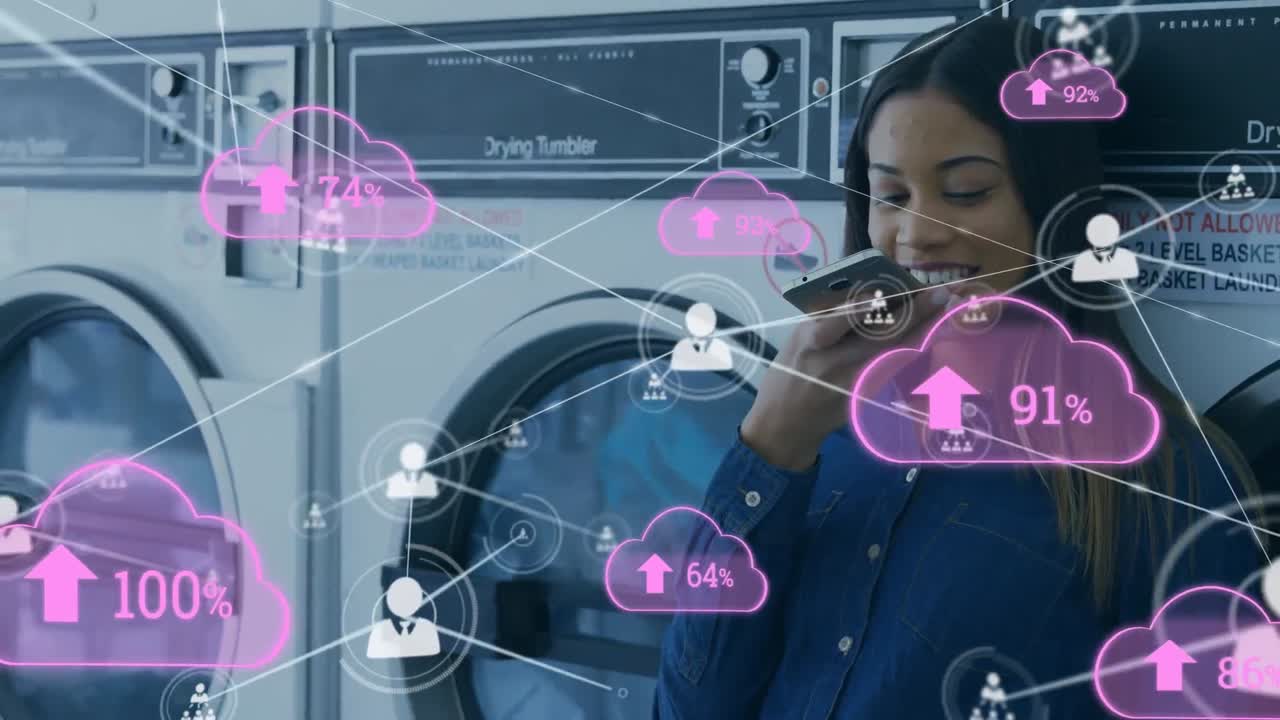 Animation of network of connections with clouds over biracial woman using smartphone at laundry