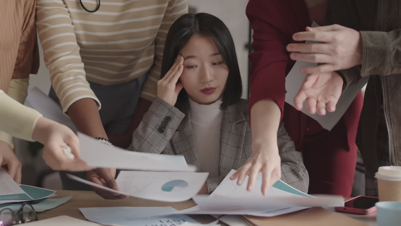 Businesswoman Stressed by Loads of Papers
