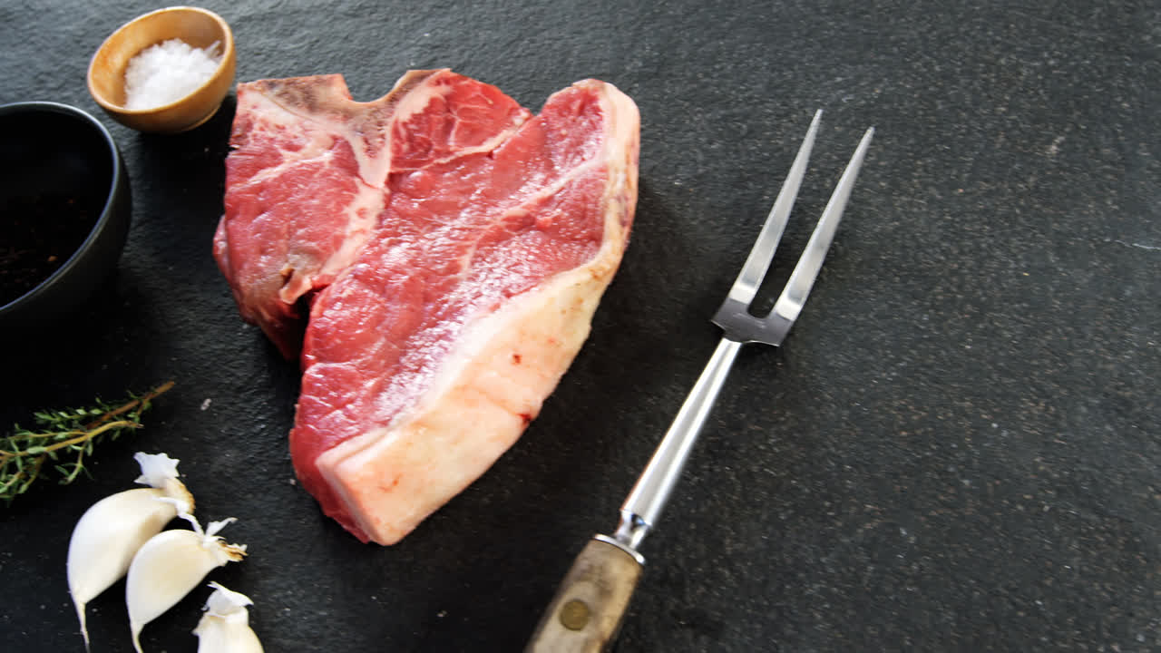 Raw beef steak and ingredients