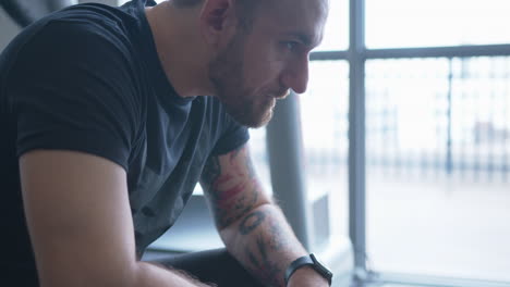 close up tilt up of a young man looking pensive in slow motion