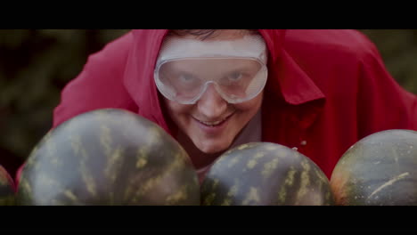 person in red coat with watermelon