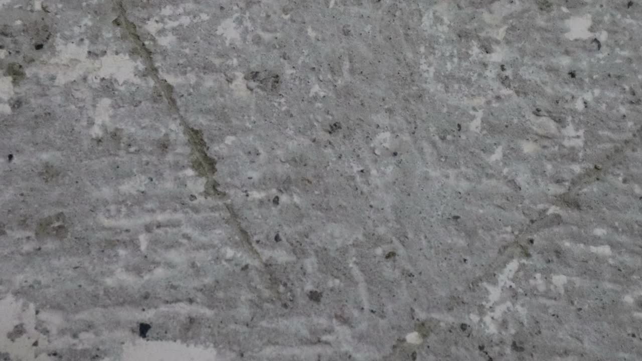 stop motion animación de fondo de textura de hormigón o útil para viejos efectos de películas utilizando la herramienta de opacidad o luma mate