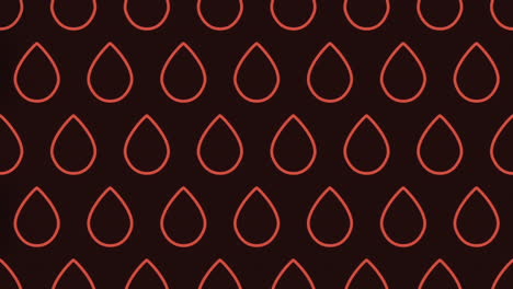 las gotas de lágrimas rojas forman un patrón intrigante en un fondo oscuro.