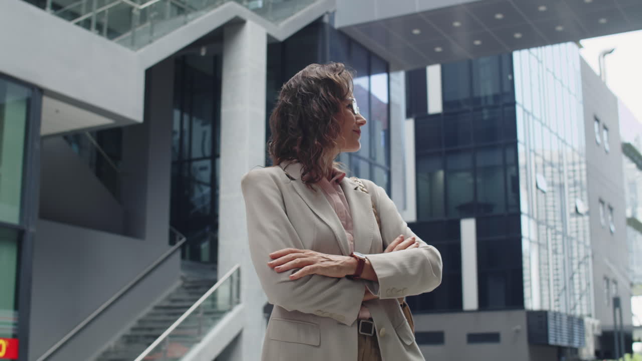 Smiling Woman in Formal Wear Posing for Camera Outdoors