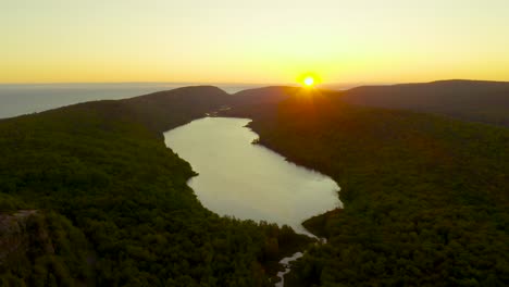 aerial view of sunrise over lake of the clouds in michigan's porcupine mountains state park