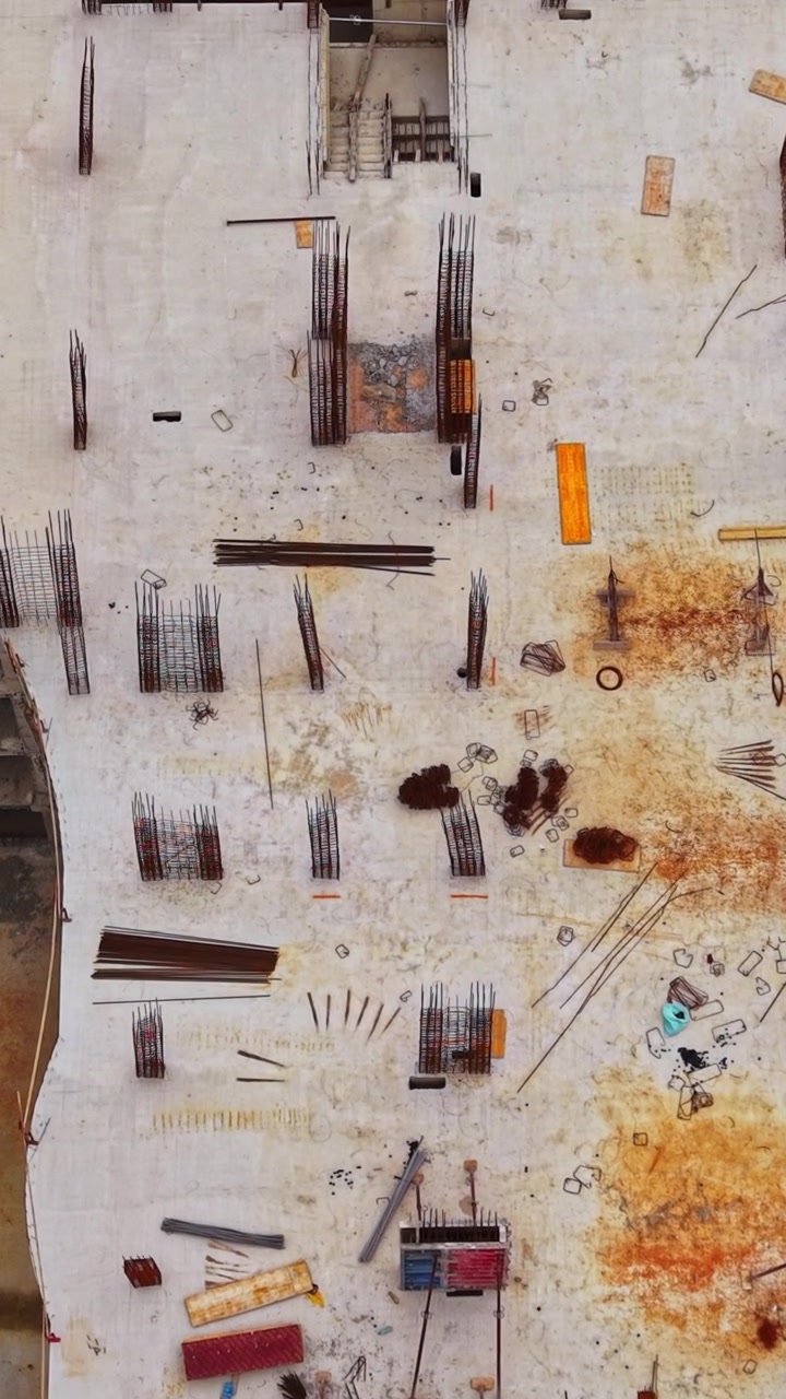 Construction site showing scaffolding and materials from above