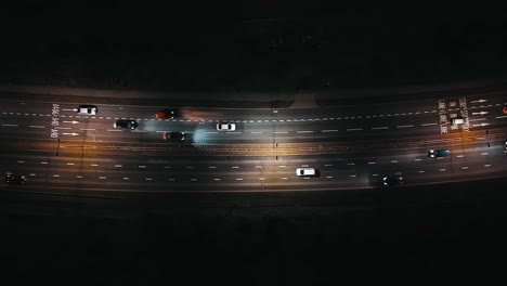 london evening commuter traffic, a40 road, aerial top-down shot at night