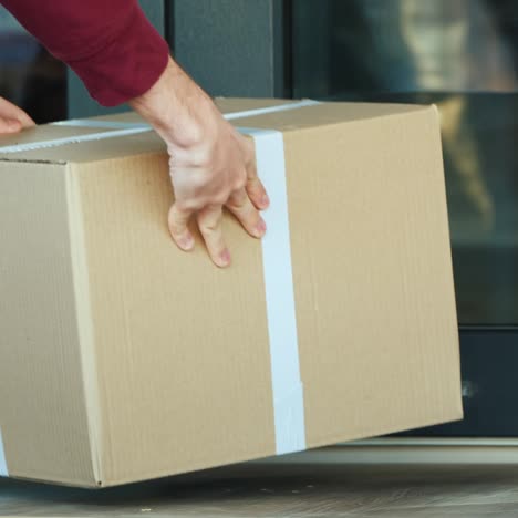 courier delivers parcel to the door of the house