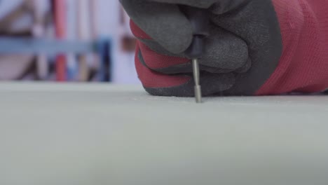 man work on wood with small rotating rasp 4k