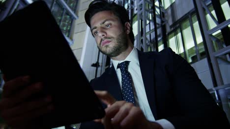 arabic businessman using wifi tablet downtown office night
